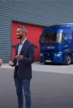 Customer and sales rep in front of a Renault Trucks E-Tech T